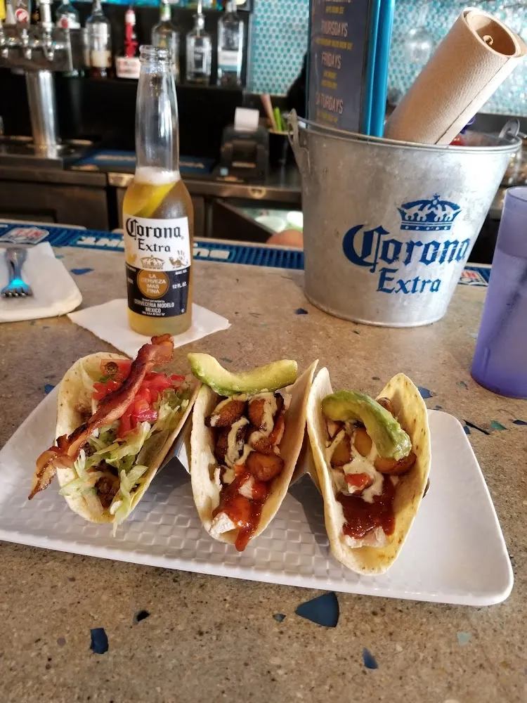Bacon Cheeseburger Taco and 2 Jerk Chicken Tacos